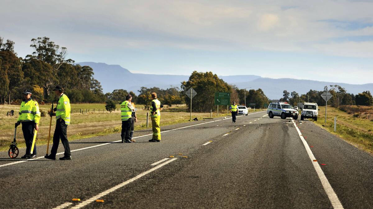Emergency services at the scene of yesterday's fatal accident near Illawarra Road on the Bass Highway. 