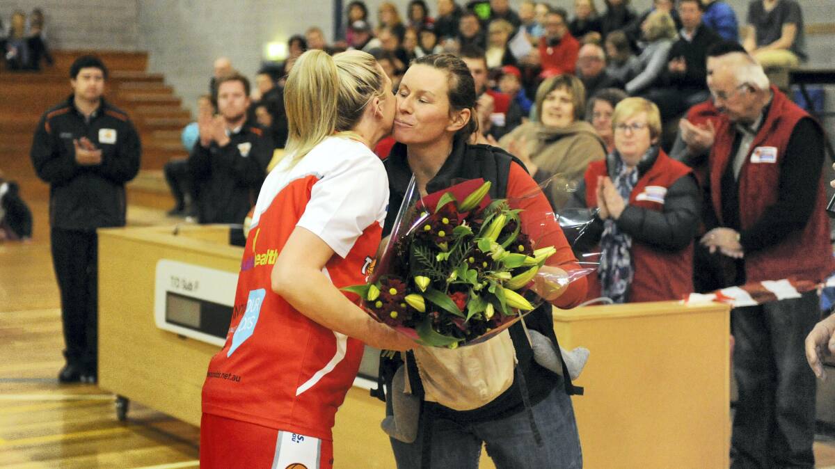 Launceston Tornado Alicia Riley is farewelled at her last game before retirement by chairwoman Janie Finlay.

