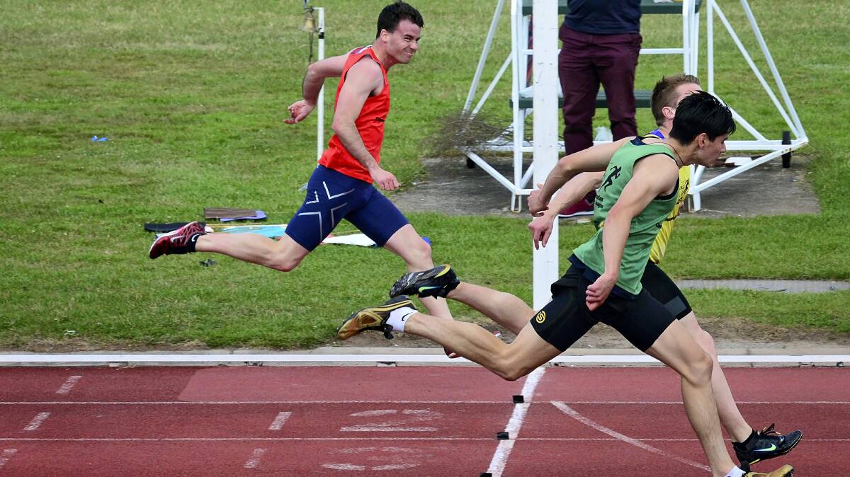 Patrick Chilvers, in the green,  edges out  Sandy Bay’s  Jared Gilroy, with Launceston’s  Andrew Robinson third in Saturday’s men’s 200m final at the Launceston  Athletics Carnival, at  St Leonards. 