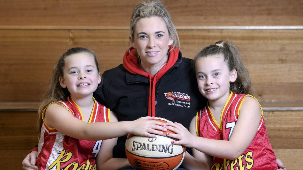 Retiring Tornadoes player Alicia Riley  with her   twin  seven-year-old daughters Elli  and Ami Shortall. Riley will be playing her final game with the Torns on Saturday night.