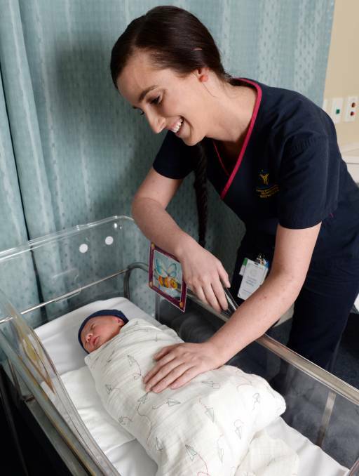 Ballarat Health Services' midwife Tess Pollard spends time checking on almost one-day-old Louie Tucker Martin on Wednesday afternoon. Picture: Kate Healy