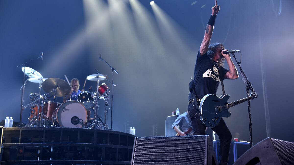 US rock act Foo Fighters and their frontman Dave Grohl led the capacity crowd through two hours of hits at the Derwent Entertainment Centre in Hobart.   Pictures: SCOTT GELSTON
