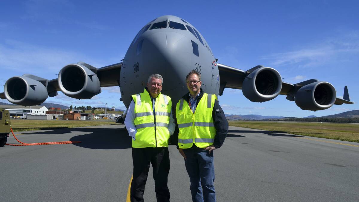 Hobart Airport chief executive Rod Parry and Tasmanian Polar Institute chairman John Brennan with the C-17A Globemaster in Hobart. Picture: GEORGIE BURGESS