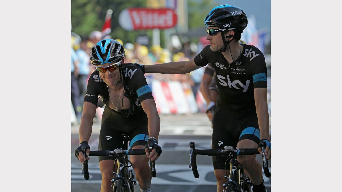 Richie Porte of Australia and Team Sky and teammates Mikel Nieve Ituralde of Spain and Team Sky cross the finish line together after Porte dropped from second place overall to 16th place in the thirteenth stage of the 2014 Tour de France, a 197km stage between Saint-Etienne and Chamrousse. Photo: Getty Images