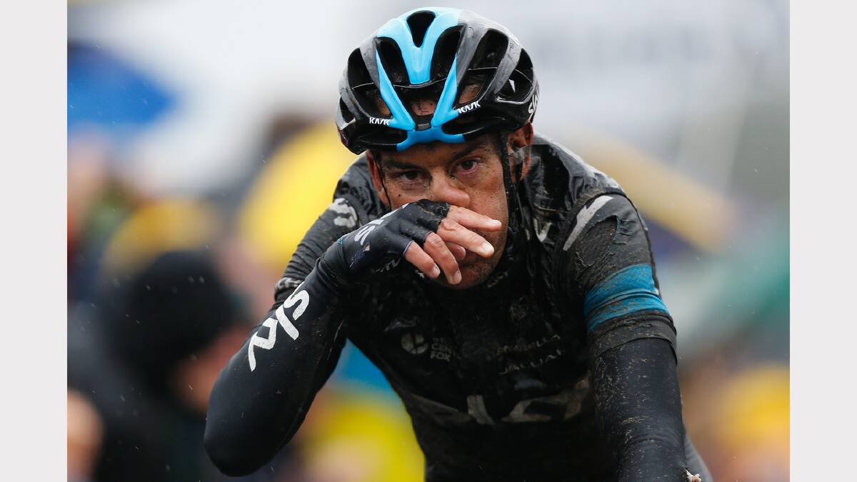 Tasmanian Richie Porte during this morning's wet stage. Photos: Getty Images