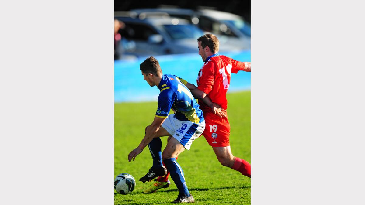 Devonport Strikers' Joel Stone (blue top)  in action against Glenorchy last season.
