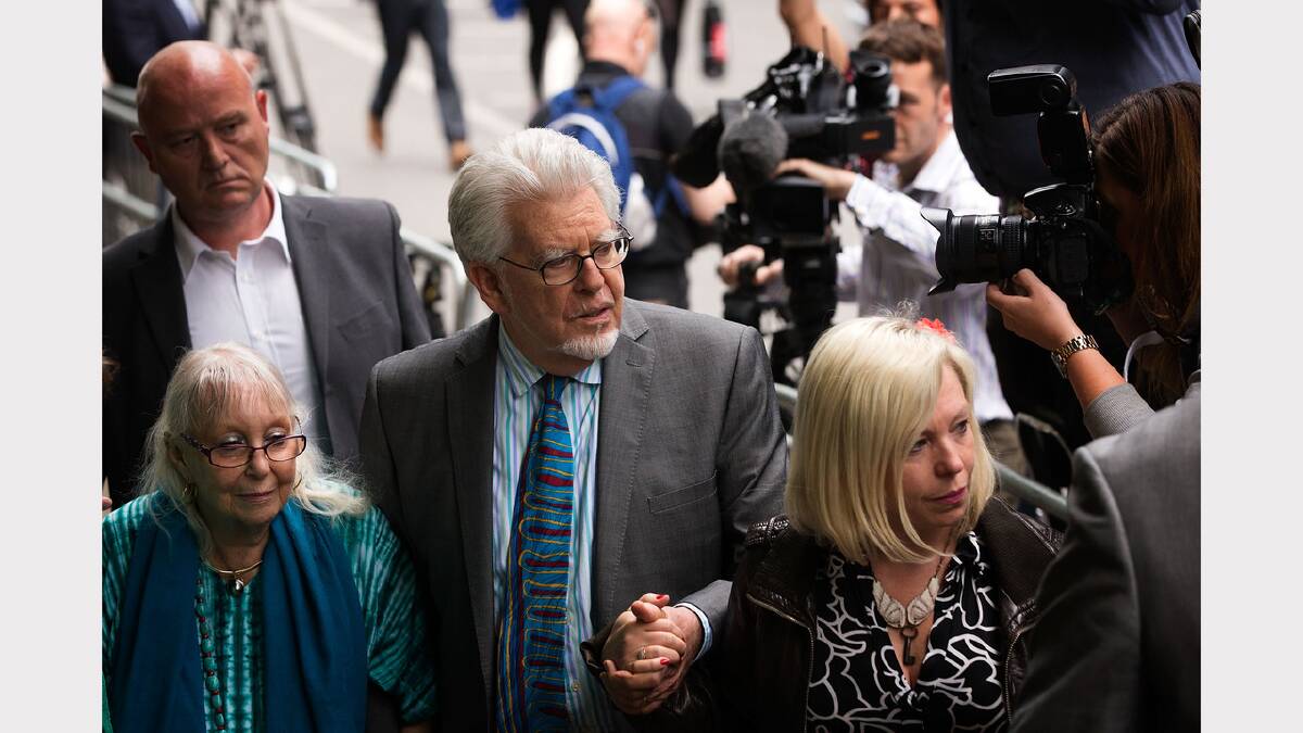 Harris leaves court with his family after being found guilty of 12 counts of indecent assault. Photo: Getty Images