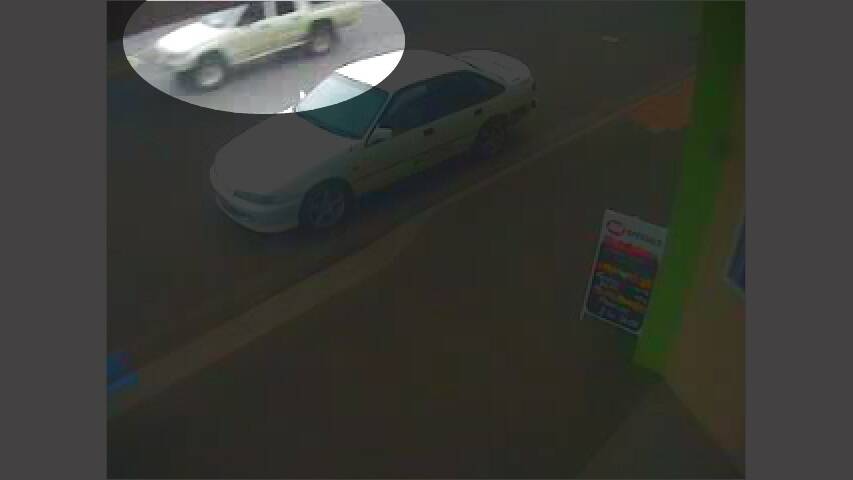 A CCTV still of the white Hilux (circled).