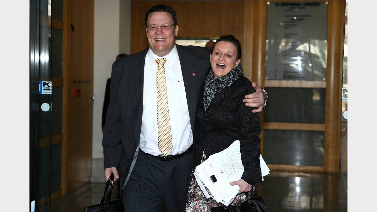 PUP senators Glenn Lazarus and Jacqui Lambie ham it up for the cameras as they depart their meeting at the PUP office at the National Press Club of Australia in Canberra on Thursday. Photo: Alex Ellinghausen