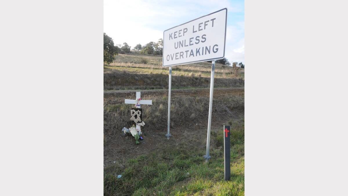 A memorial marks the site of the fatal crash on the Midland Highway.
