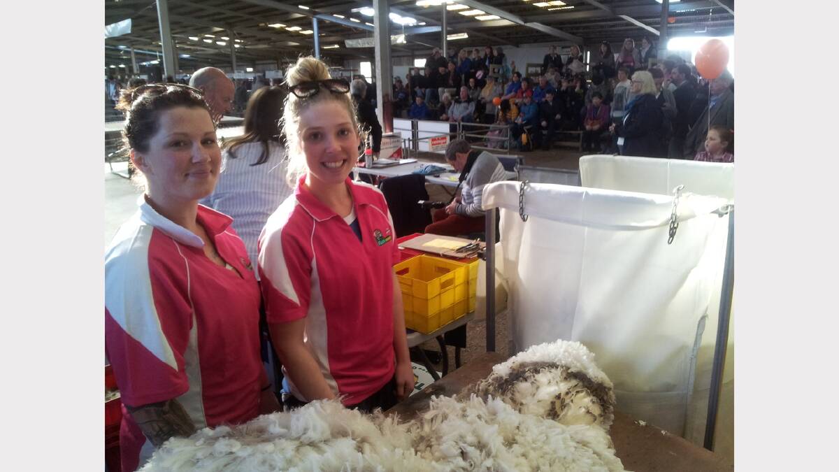 Georgie Newett and Brearne Bingley inspecting the quality of the wool at Campbell Town.