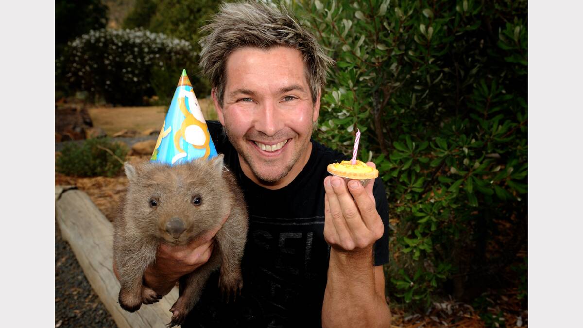 Zoologist and TV host Chris Humphrey and Tasmania Zoo's 18 month old Wombat Carrie  celebrate Tasmania Zoo's 11th birthday.	Photo by Geoff Robson