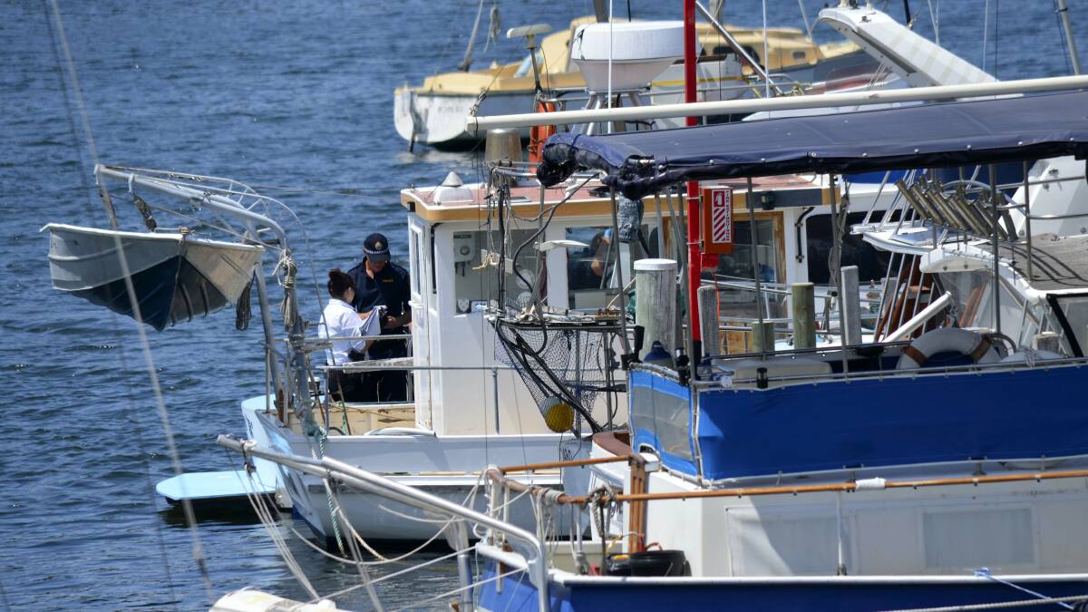 The bodies of two men were discovered on a boat at Prince of Wales Bay marina. Picture: ADAM LANGENBERG