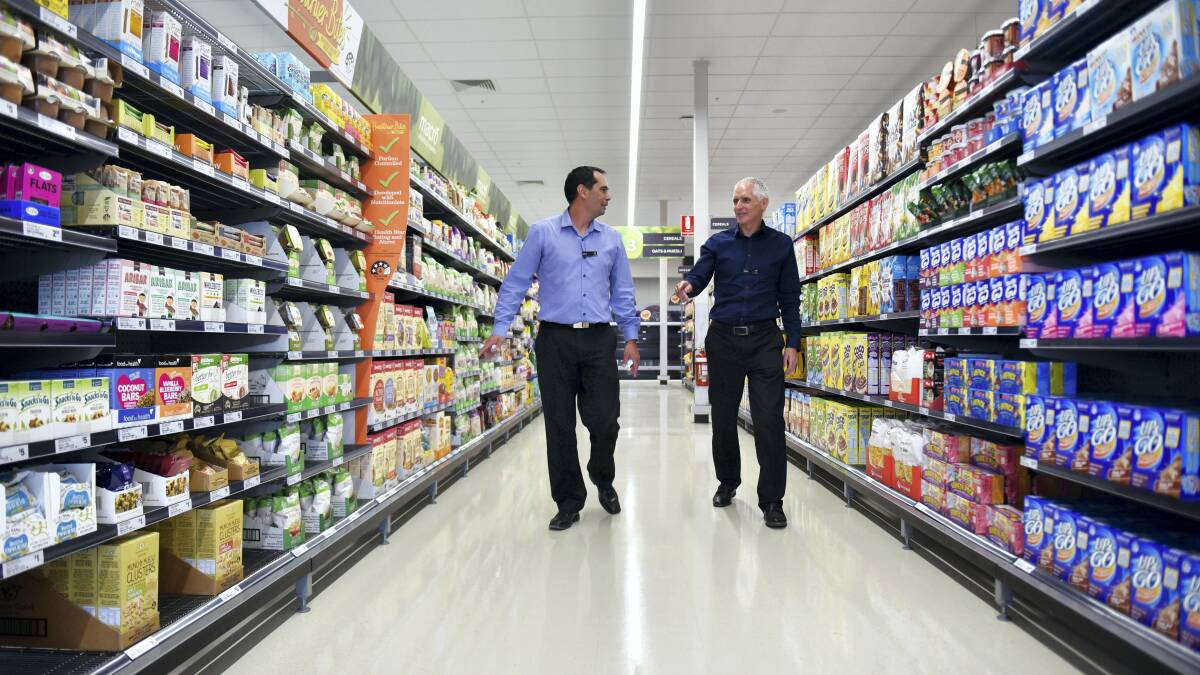 Store manager John  Baker and Tasmanian operations manager Mark Stanley look through the new Woolworths supermarket in Wellington Street. Pictures:  SCOTT GELSTON