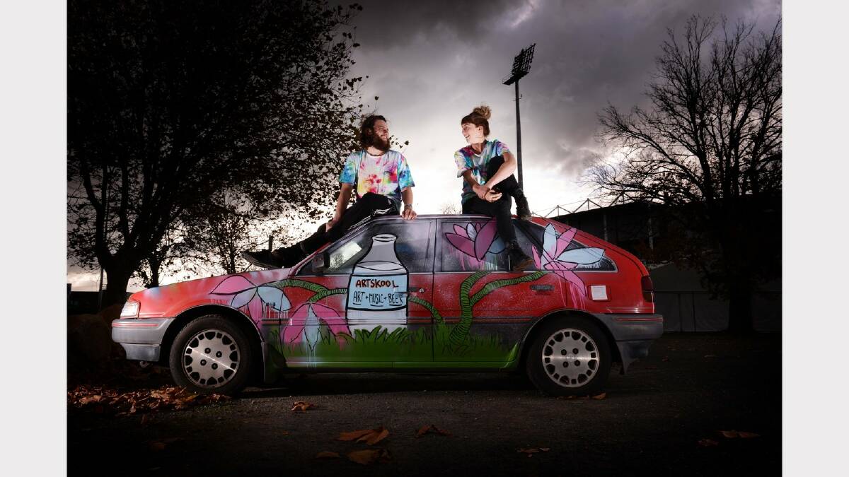 Artskool curators Paul Eggins and Mel Fidler with a spray-painted car that forms part of the Artskool exhibition. Picture: SCOTT GELSTON
