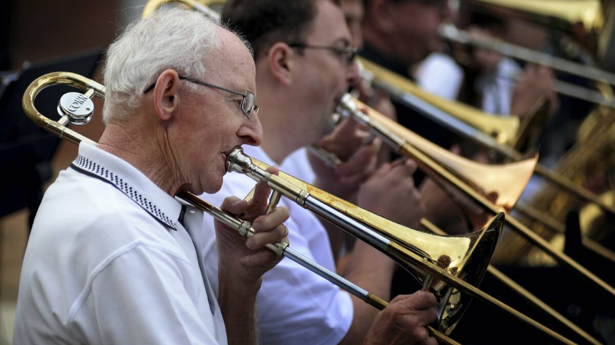 George Fish plays with St Joe’s Big Band in the Devonport mall. Picture: GEOFF ROBSON