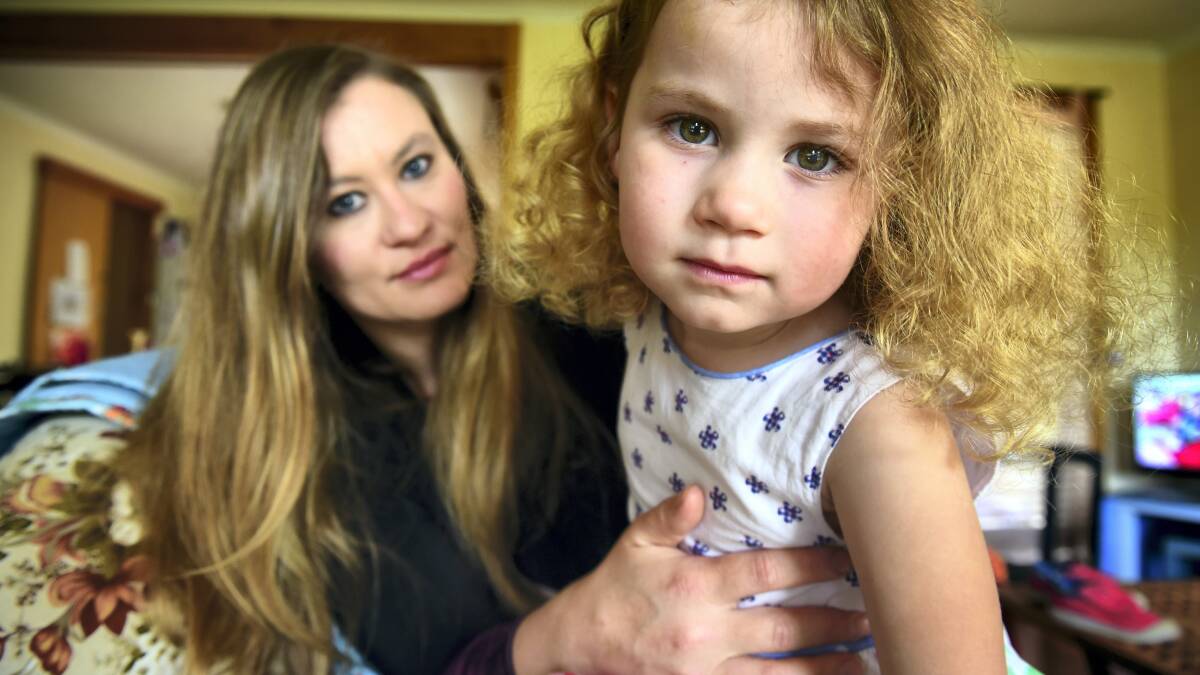 West Tamar mother Hollie Watson with Matilda, who  became paralysed after picking up a virus and suffers from  an extremely rare condition similar to polio.Picture: PAUL SCAMBLER