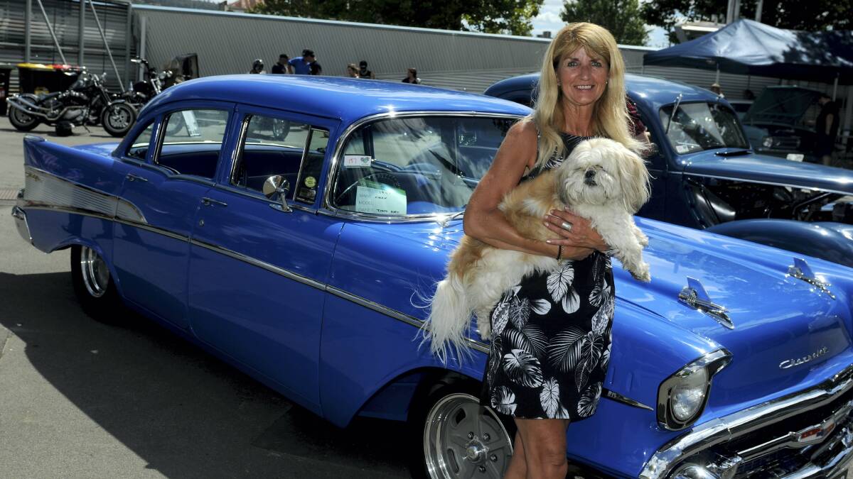 Keren Keegan, of Hobart, with her husband’s car, a ’57 Chev, which won the People’s Choice Award at the USA Day All Makes Car Show. Picture: GEOFF ROBSON