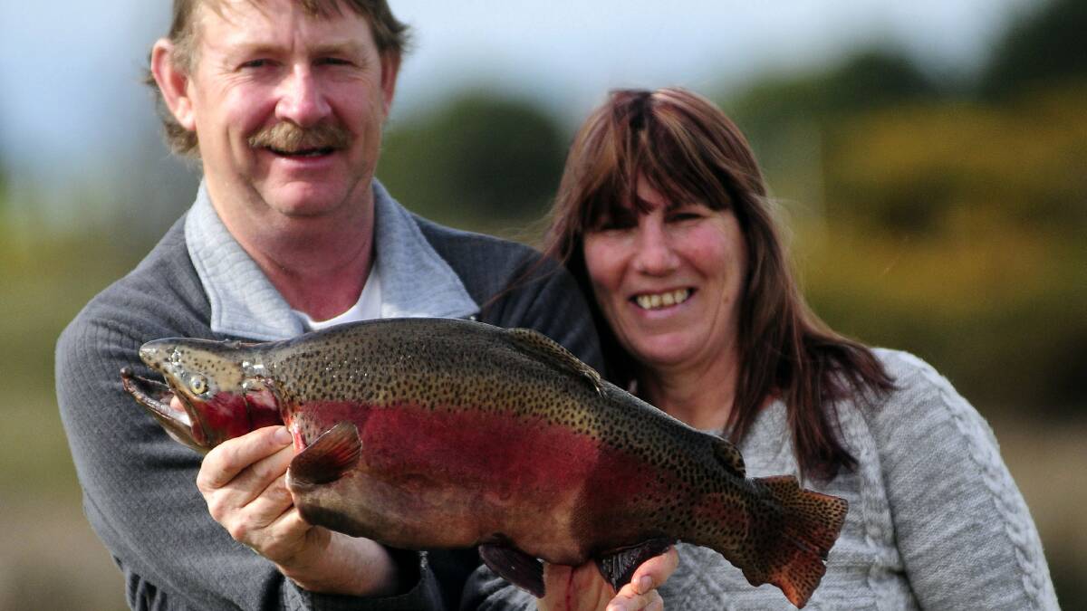 Peter Burr and Linda Polden, of Burnie, with Mr Burr’s 3.7 kilogram  rainbow trout caught at Brumbys Creek. Picture: PETER SANDERS