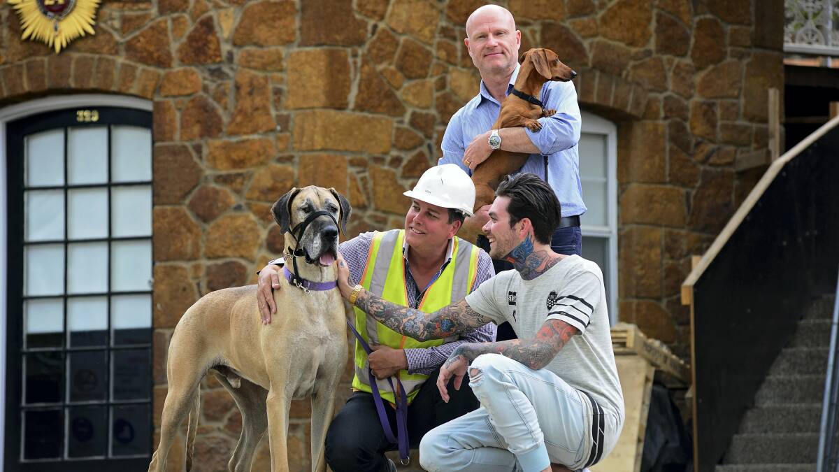 Dean Cocker, Peter West and Matthew Garwood with George the great Dane and Alfie the miniature dachshund, preparing for next month’s Paws for a Cause at Penny Royal in Launceston. Picture: PHILLIP BIGGS