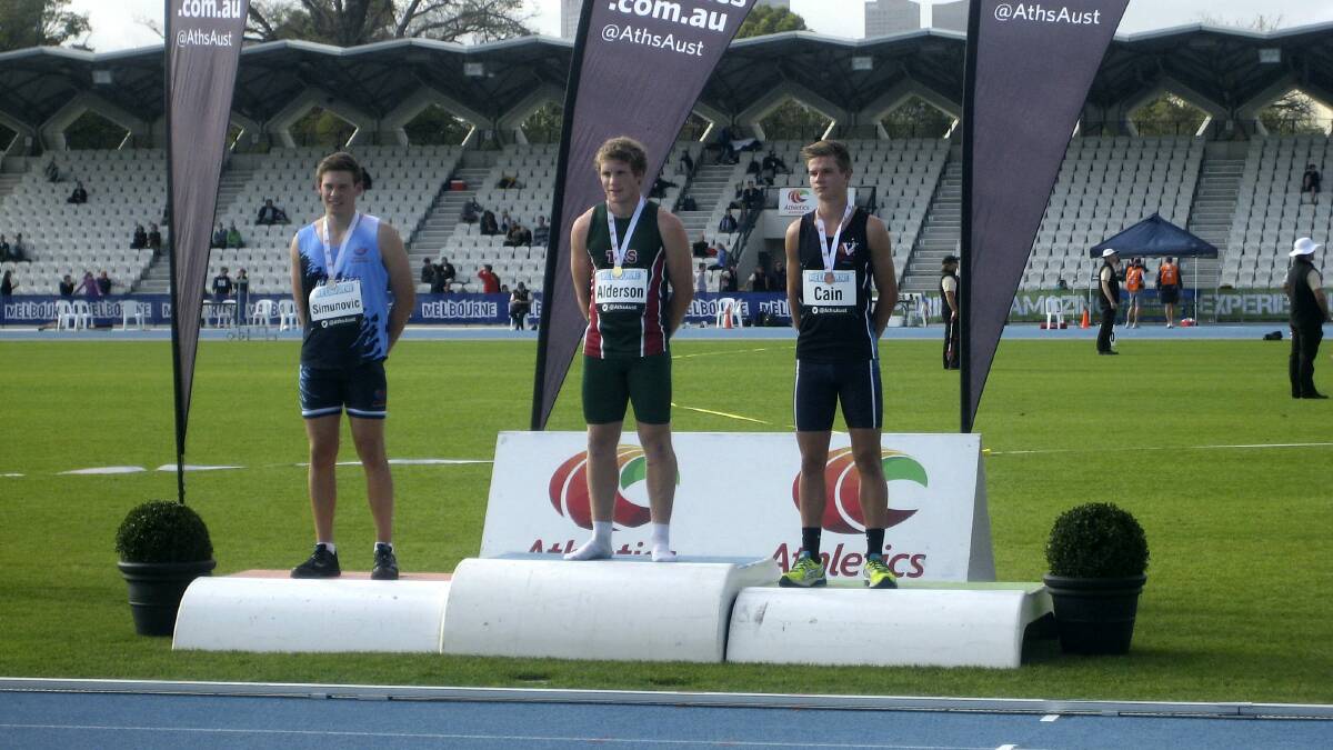 Launceston's  Sam Alderson stands on the podium after beating  Zach Simunovic, of New South Wales, and  Lewis Cain, of Victoria,  to claim the  under-18  decathlon championship in Melbourne.
