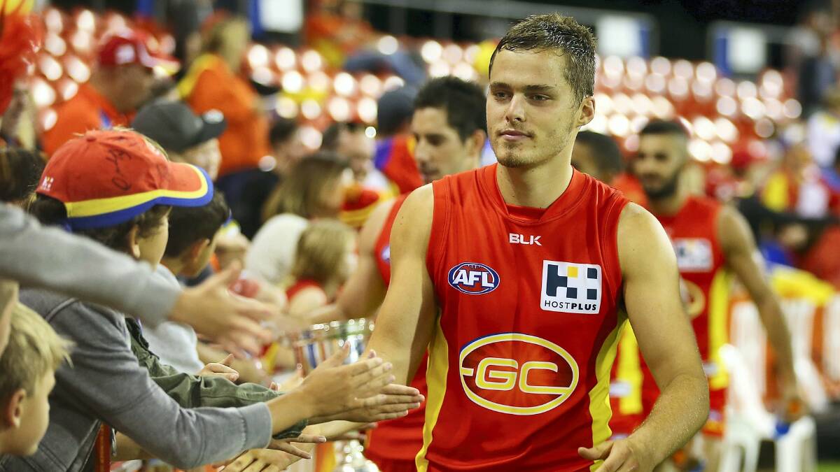 Running Gold Coast defender Kade Kolodjashnij  was in top form at the weekend  collecting  23 touches at 83 per cent efficiency including  a career-high 13 marks and six rebound 50s. Picture: GETTY IMAGES