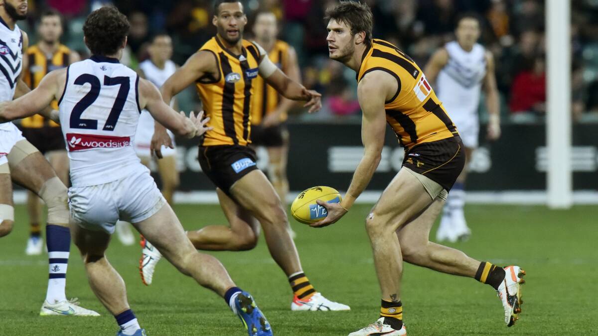 Grant Birchall controls the ball for Hawthorn against Fremantle.