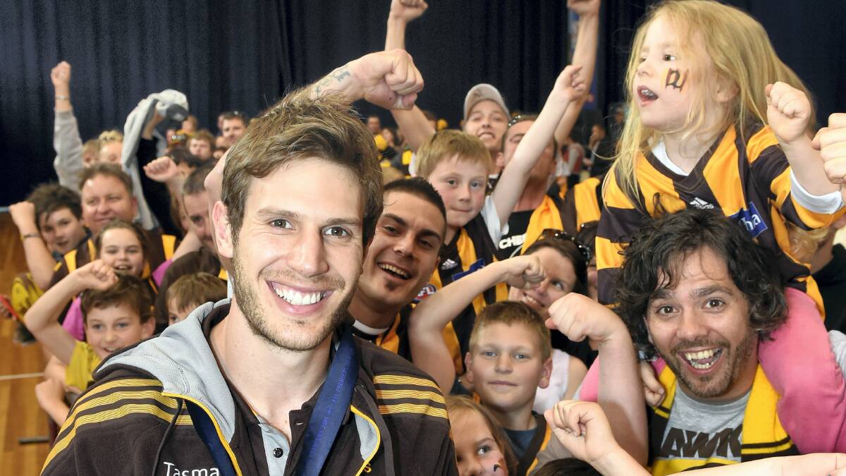 Grant Birchall celebrates the AFL premiership with Hawthorn fans in Launceston yesterday. Picture: MARK JESSER
