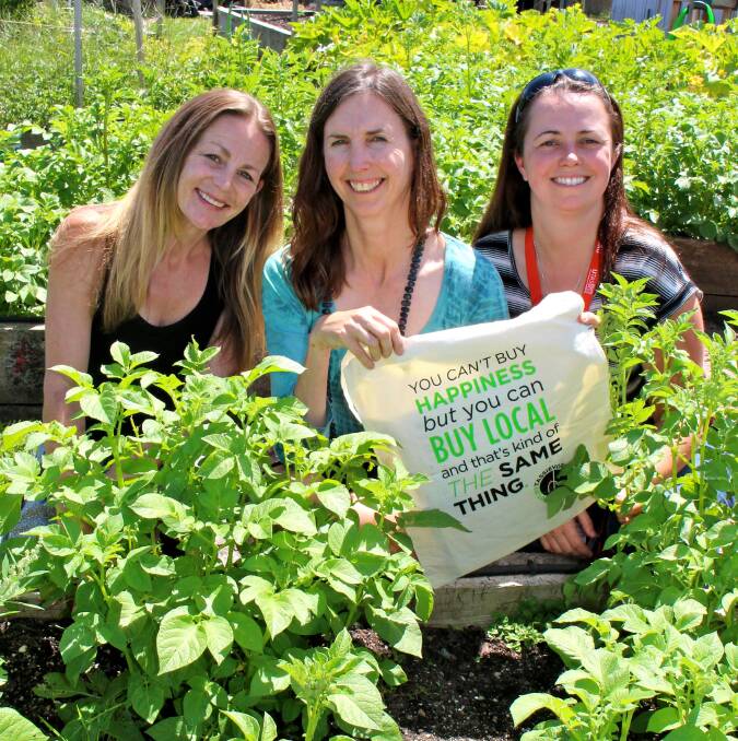Kylie Allen, UTas student, Sandy Murray, Lecturer and Kym Blechynden, Lecturer, UTAS promoting the Tassievore campaign, that encourages people to eat only local food for the month of March.
