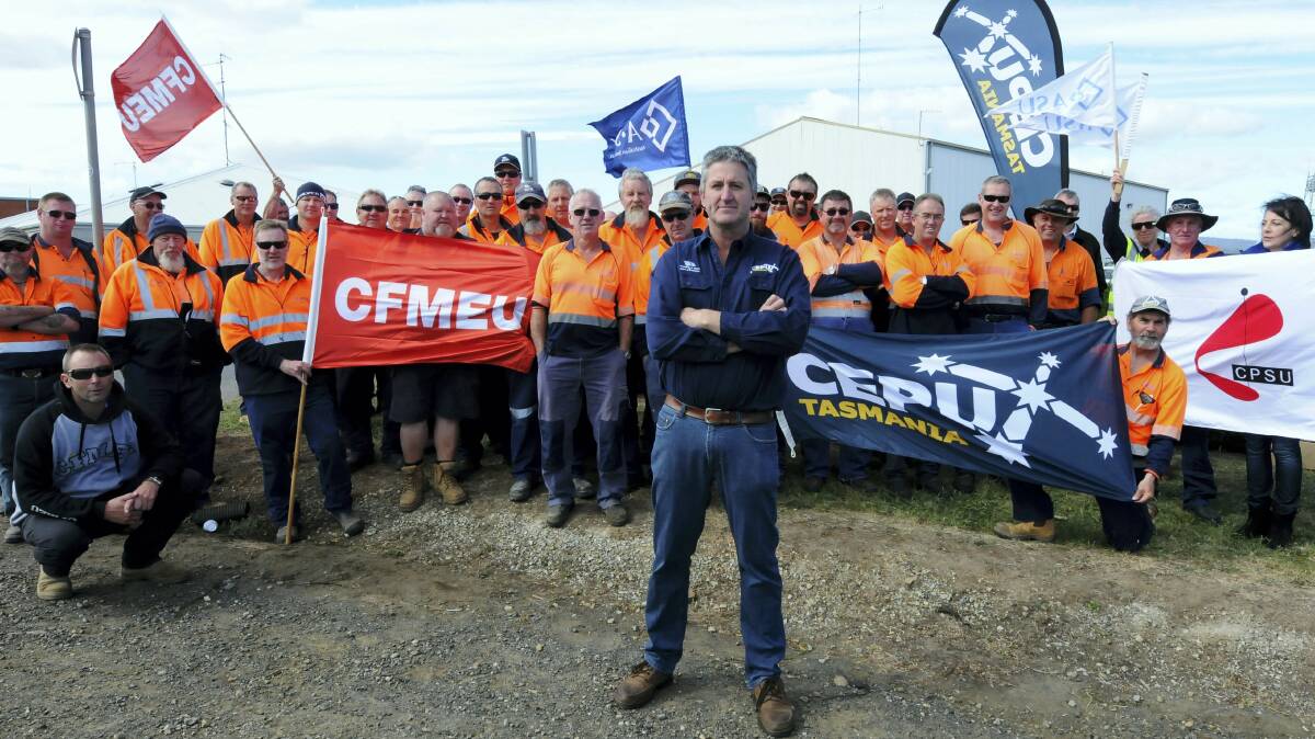 CEPU state organiser Todd Lambert with TasWater workers at a stopwork meeting outside the Rocherlea Depot yesterday. Picture: NEIL RICHARDSON