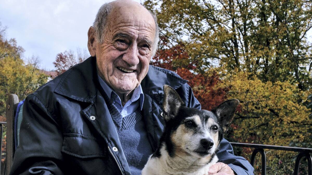 Ray Baker, who retired recently after 45 years as a cabbie, with Willie the dog ... since retiring at 79, Mr Baker has focused on his two great loves - his garden and his relatives. Picture: NEIL RICHARDSON