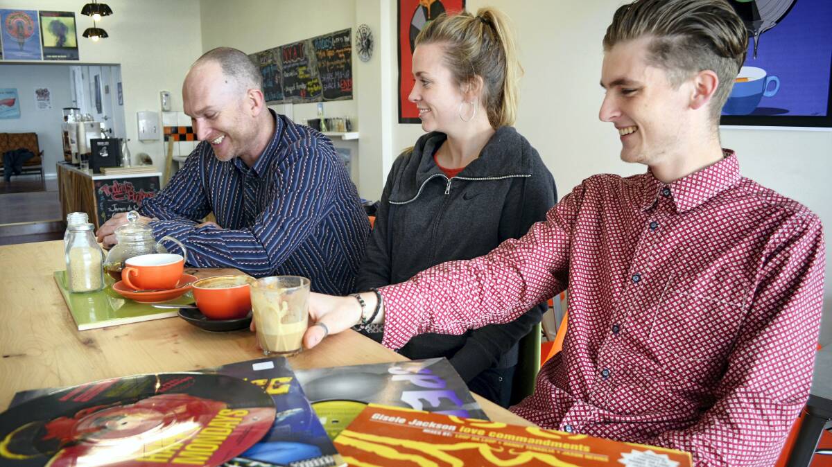 Shots on Wax owner Andy Collings, manager Emma Norton and barista Matthew Flack enjoy a quiet moment before the cafe opens today. Picture: JAMES BRADY