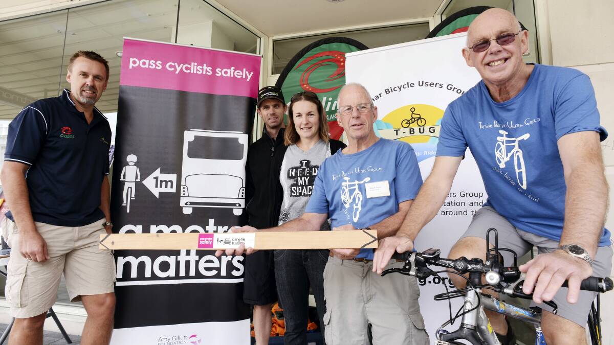 Cycling safety advocates Colin Burns, Ben Mather, Louise Padgett, Malcolm Cowan and Colin Williams at their pop-up information table in the Brisbane Street Mall. Picture: SCOTT GELSTON