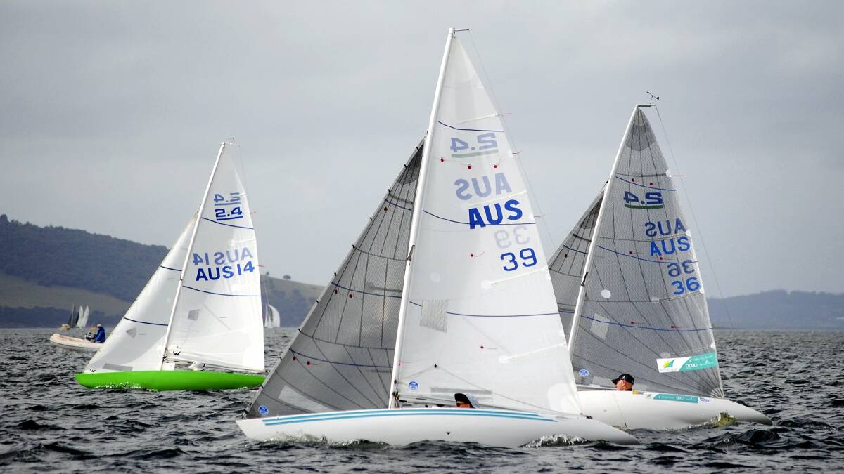 Matt Bugg (right) sailing against Richard Fisher and Lisa Blackwood in the 2.4mR class at this year’s Bellerive Regatta. Picture: PETER CAMPBELL