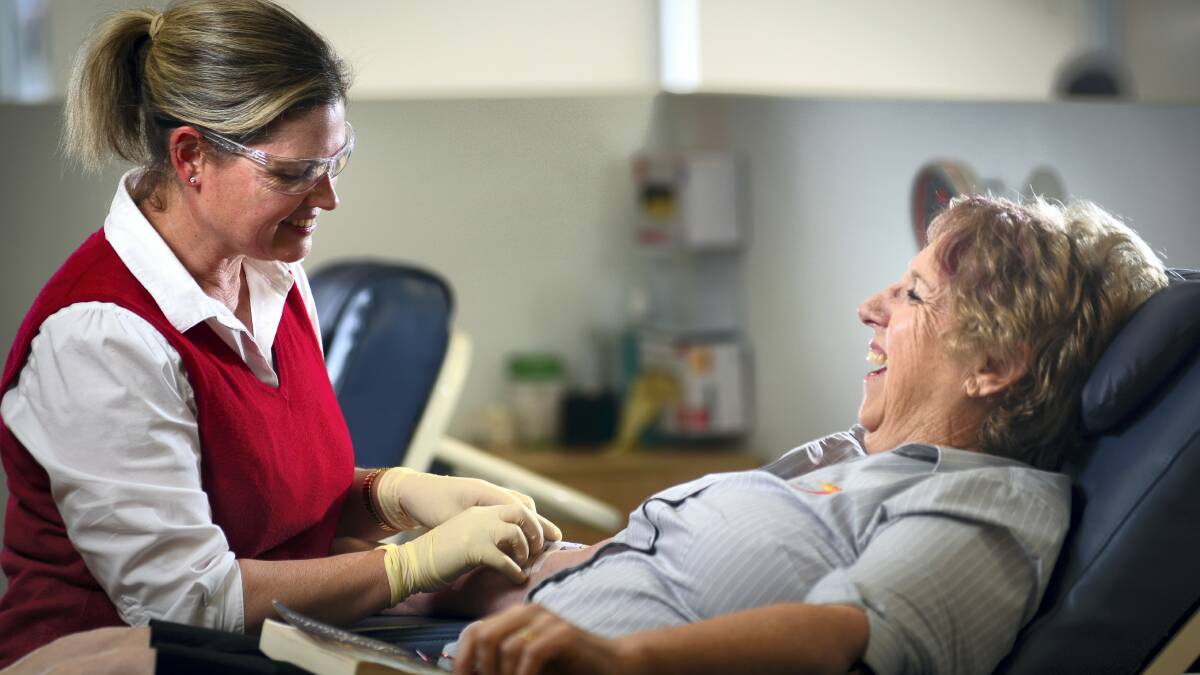 Registered nurse Rachael Roney takes blood from Necia Ruthven, of Launceston, at the Australian Red Cross blood service Launceston Donor Centre. Picture: PHILLIP BIGGS
