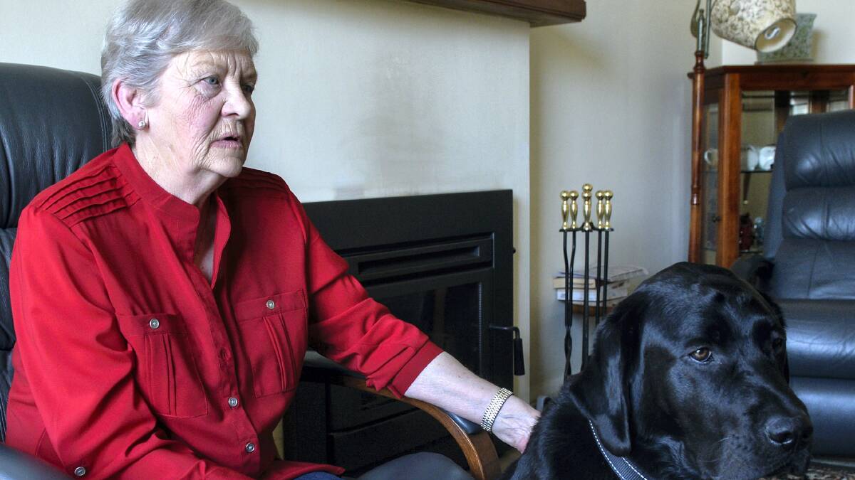 Visually impaired Helen Turner with her guide dog Eddie. Eddie was attacked in the street and is now frightened to leave the house. Picture: NEIL RICHARDSON