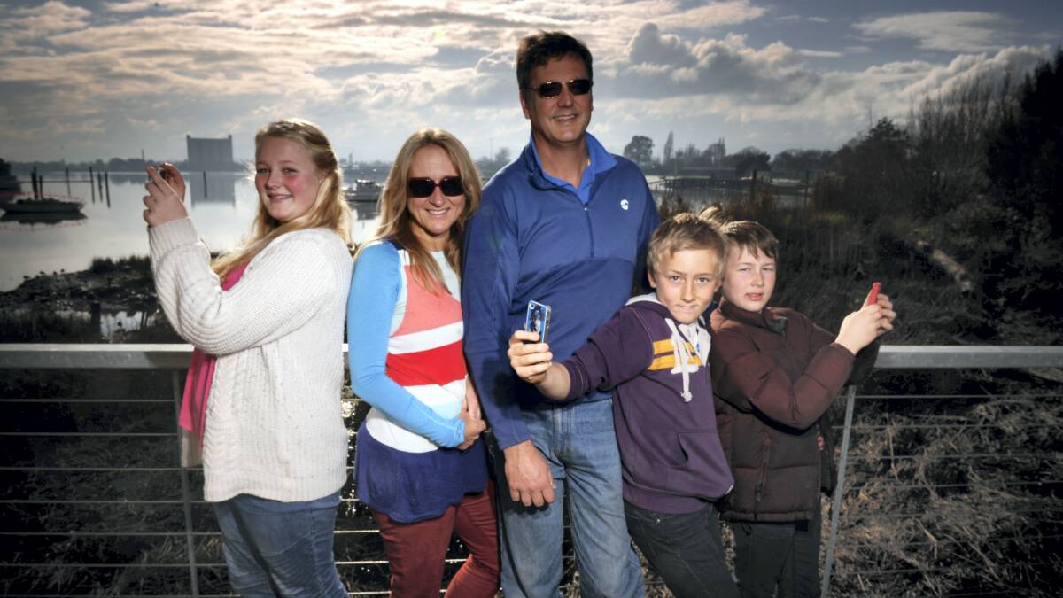 Tash, 14, Michelle, Simon, Ben, 12, and Seb Frost, 10, are heading overseas as a family to study and work. Picture: SCOTT GELSTON