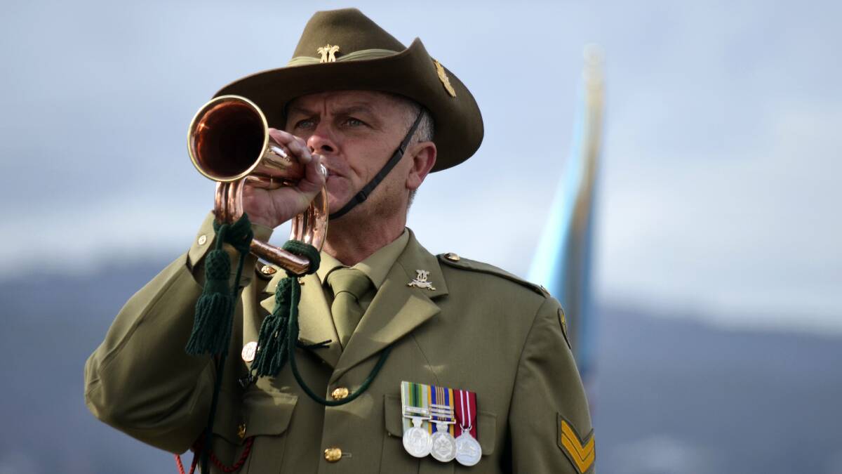 Corporal Ash Thomson performs the Last Post in Hobart yesterday. Picture: DANIEL McCULLOCH