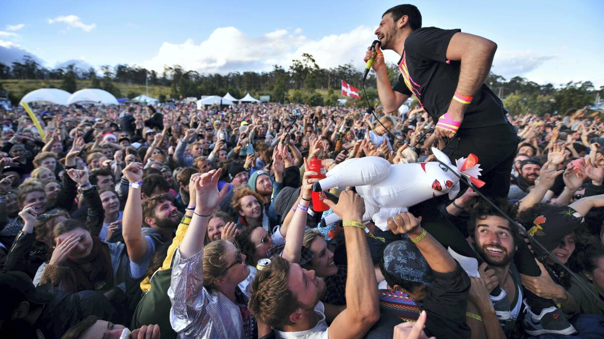 Bluejuice gives its Tasmanian audience a fond farewell as singer Jake Stone jumps into the crowd. Picture: SCOTT GELSTON