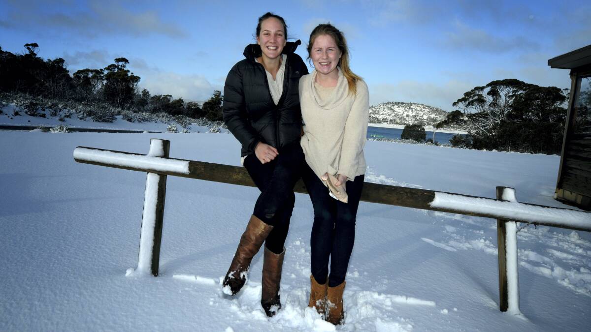 Bec Downie, of Bothwell, and Connie Campbell, of Sydney, enjoy the snow at Great Lake yesterday. Picture: GEOFF ROBSON
