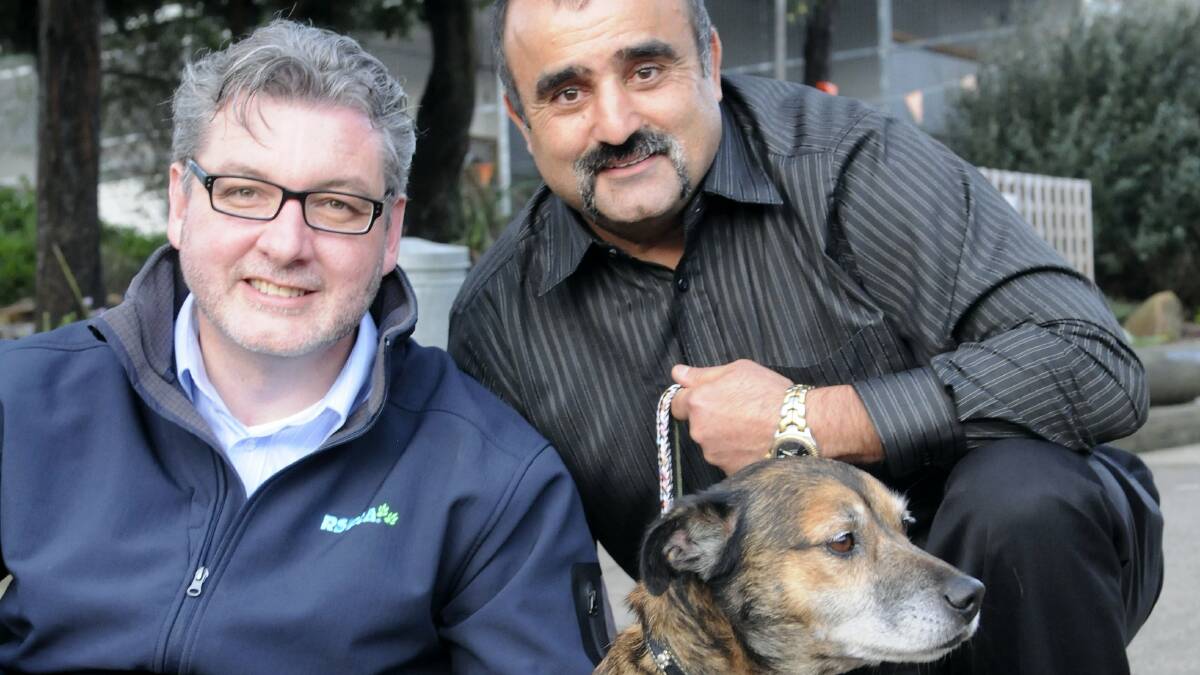 RSPCA Tasmania general manager Peter West and RSPCA operations manager in Queensland George Costi meet Dougie at the Launceston RSPCA headquarters. Picture: PAUL SCAMBLER