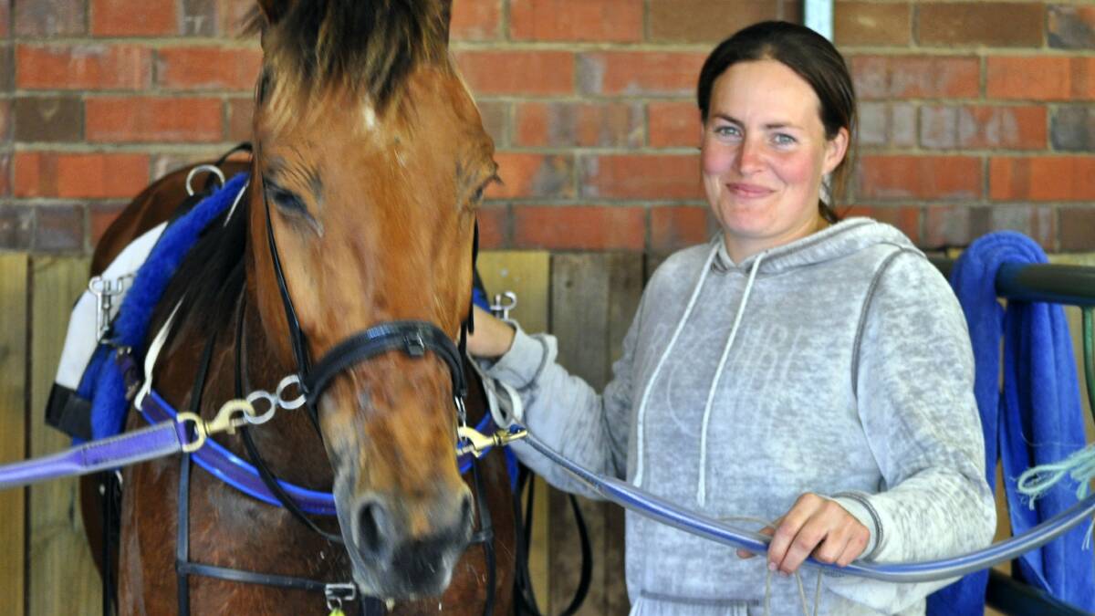 Trainer Melissa Maine with Hello Good Shanks after his win at Mowbray on Friday night. Picture: GREG MANSFIELD