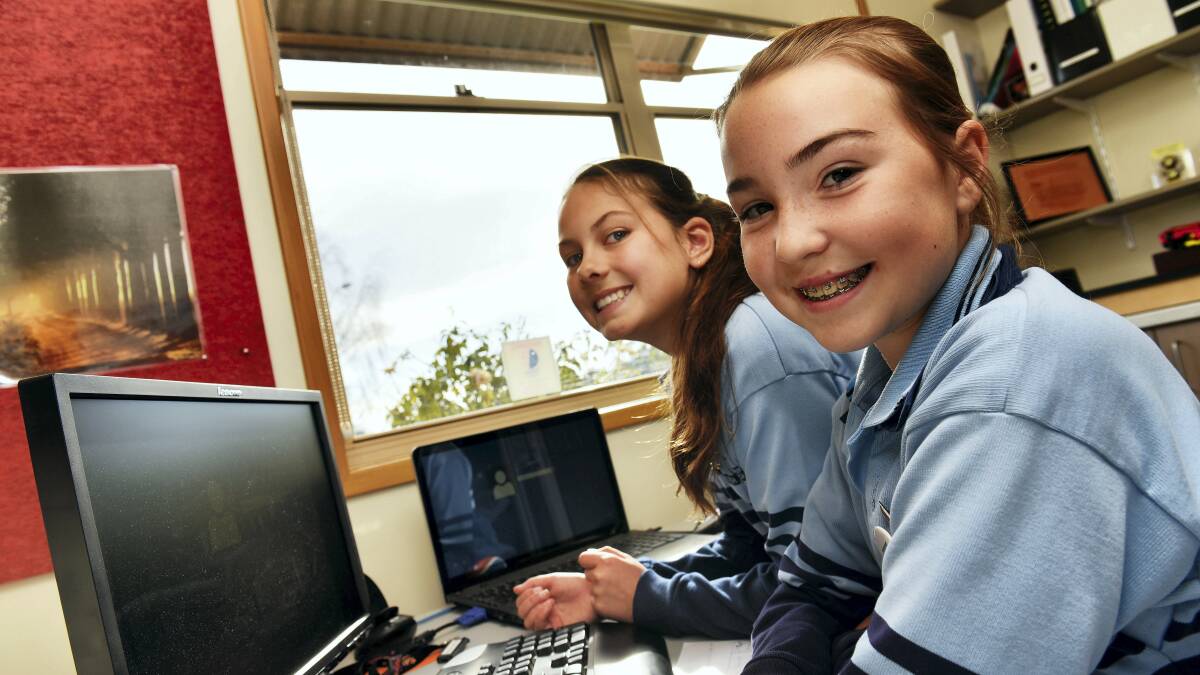 Perth Primary School grade 6 pupils Tahlia Perkins and Chloe Eldershaw at work in the principal’s office. Picture: SCOTT GELSTON