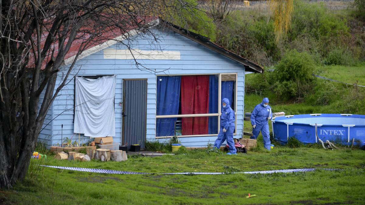 Police investigators collect forensic evidence at the Bridgewater house yesterday. Picture: ROSEMARY BOLGER