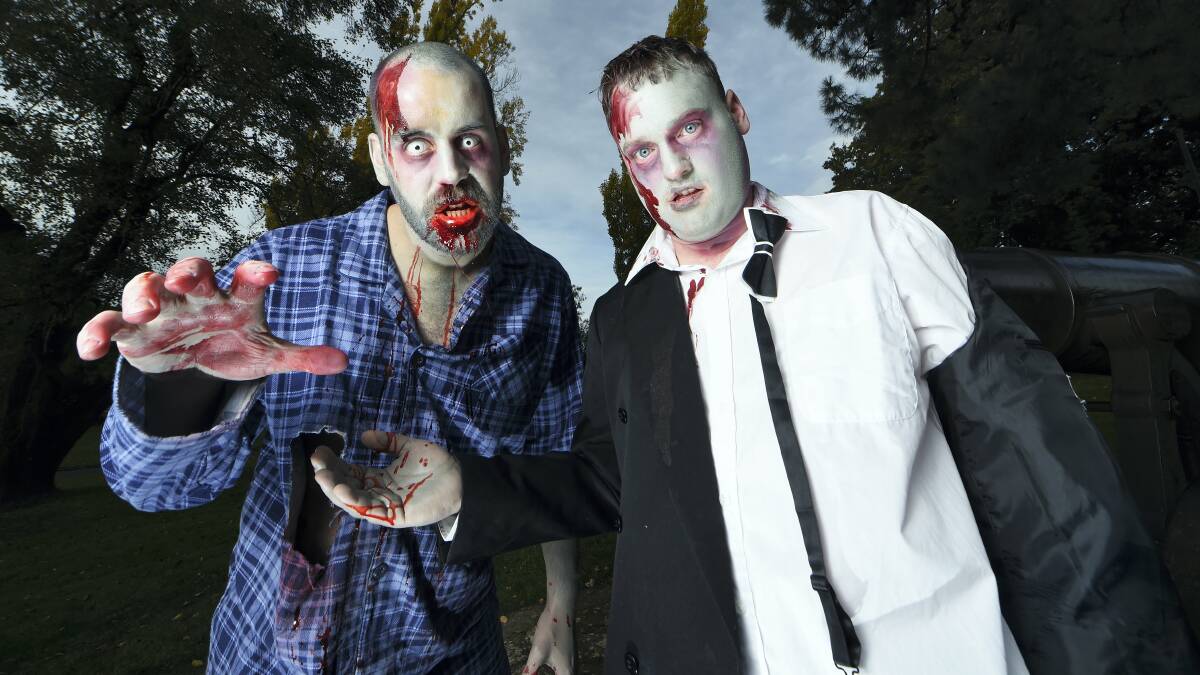 James Cassidy, of Youngtown, and Chris Dolbey, of Newnham, try out their zombie costumes in preparation for today’s Zombie Walk.  Picture: MARK JESSER