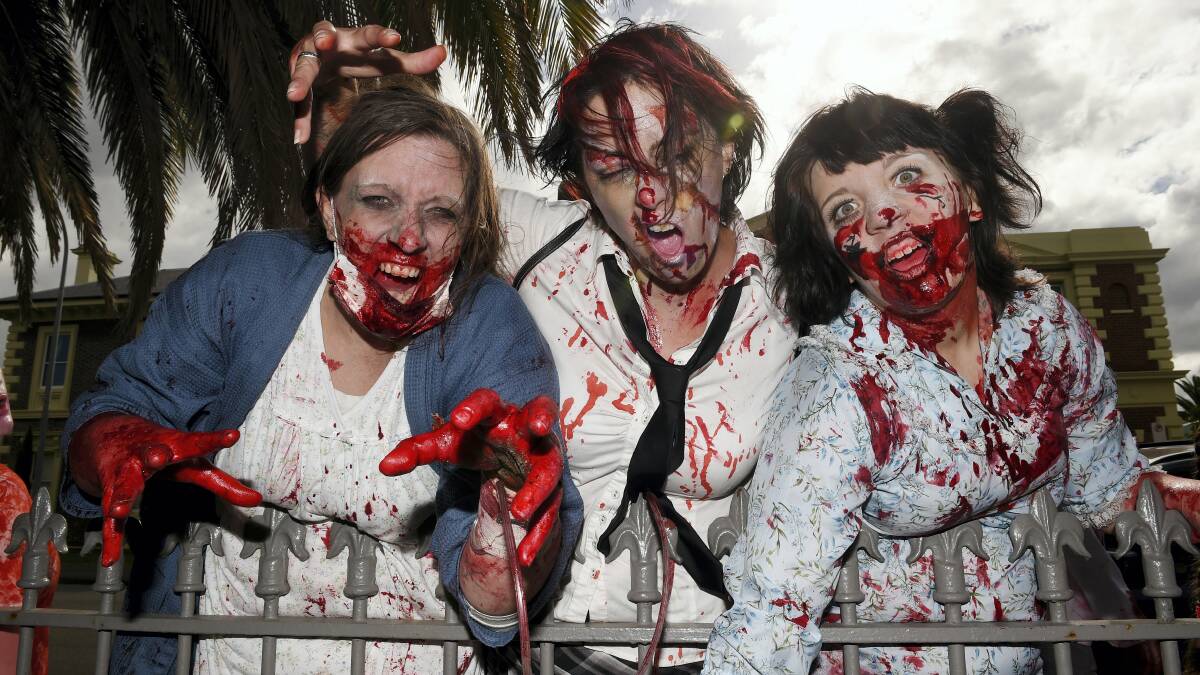 Donna Owen, Amanda Hornsby and Bradly Owen, all of Launceston, take part in yesterday’s Zombie Walk. Picture: MARK JESSER