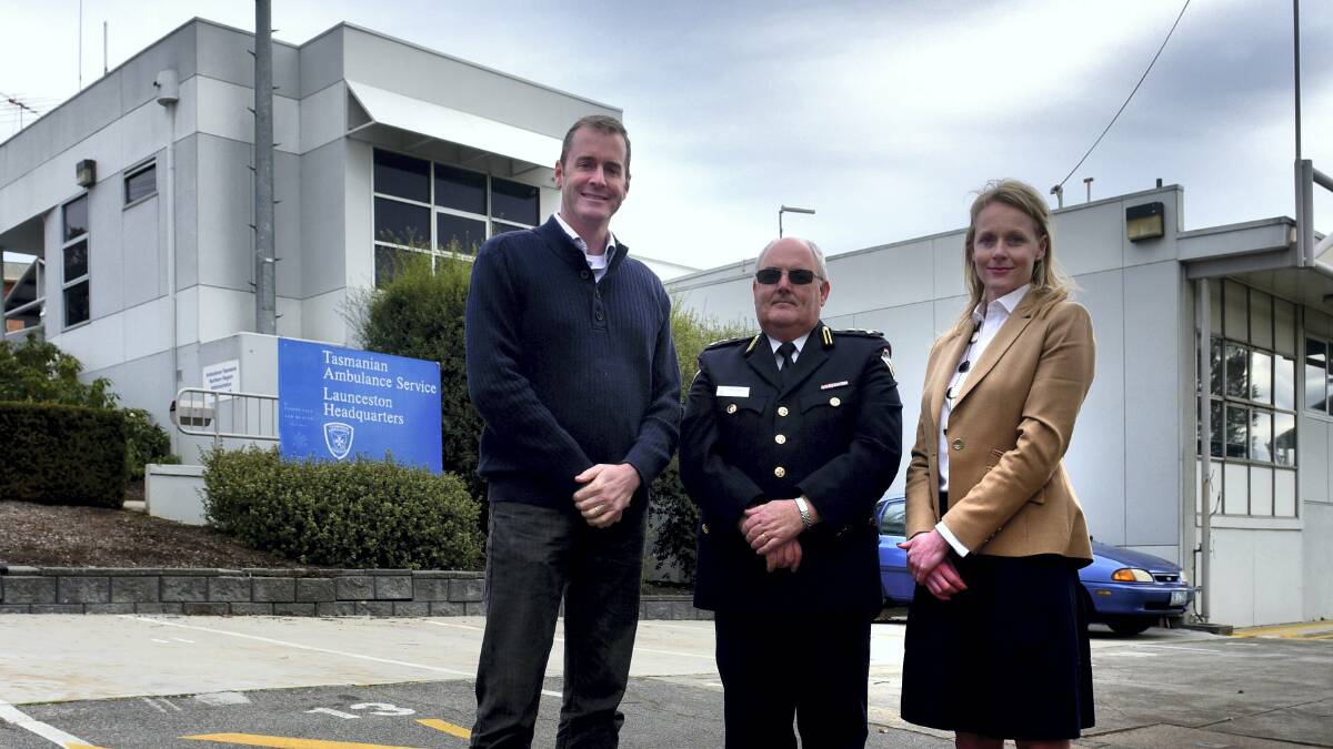 Health Minister Michael Ferguson and Ambulance Tasmania acting CEO Paul Templar with Bass Liberal MHA  Sarah Courtney at the Launceston Ambulance station. Picture: PAUL SCAMBLER
