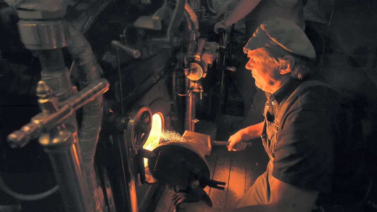 Pete Nolte fires up the steam engine on the West Coast Wilderness Railway. Picture: MARK JESSER