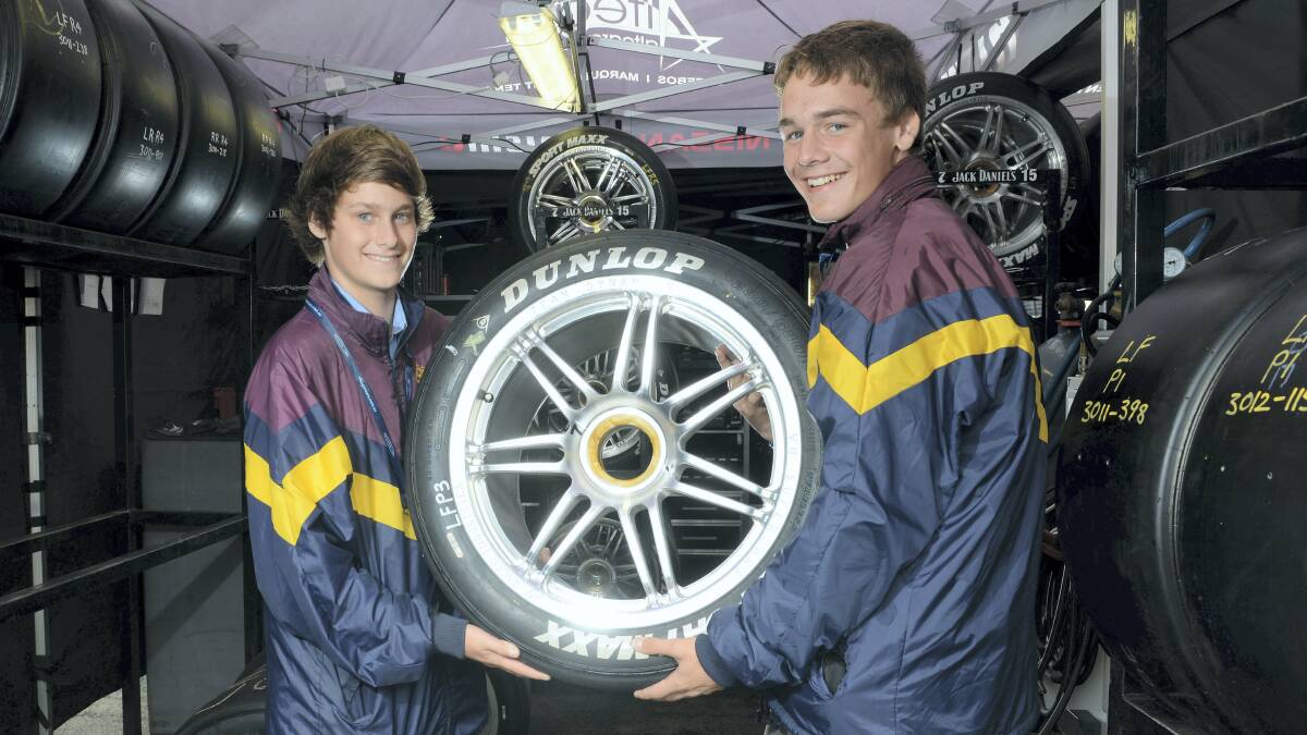 Riverside High School's Brad Smith, 15, and Ryan Gregson, 14, take a look in one of the tyre workshops. Picture: MARK JESSER