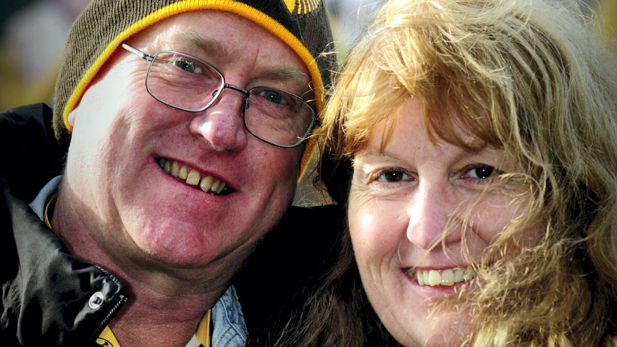 Steven and Jane Brookes, of Hobart, at yesterday’s AFL clash at Aurora Stadium ... It was part of their marriage contract to both be Hawthorn members. Picture: PHILLIP BIGGS